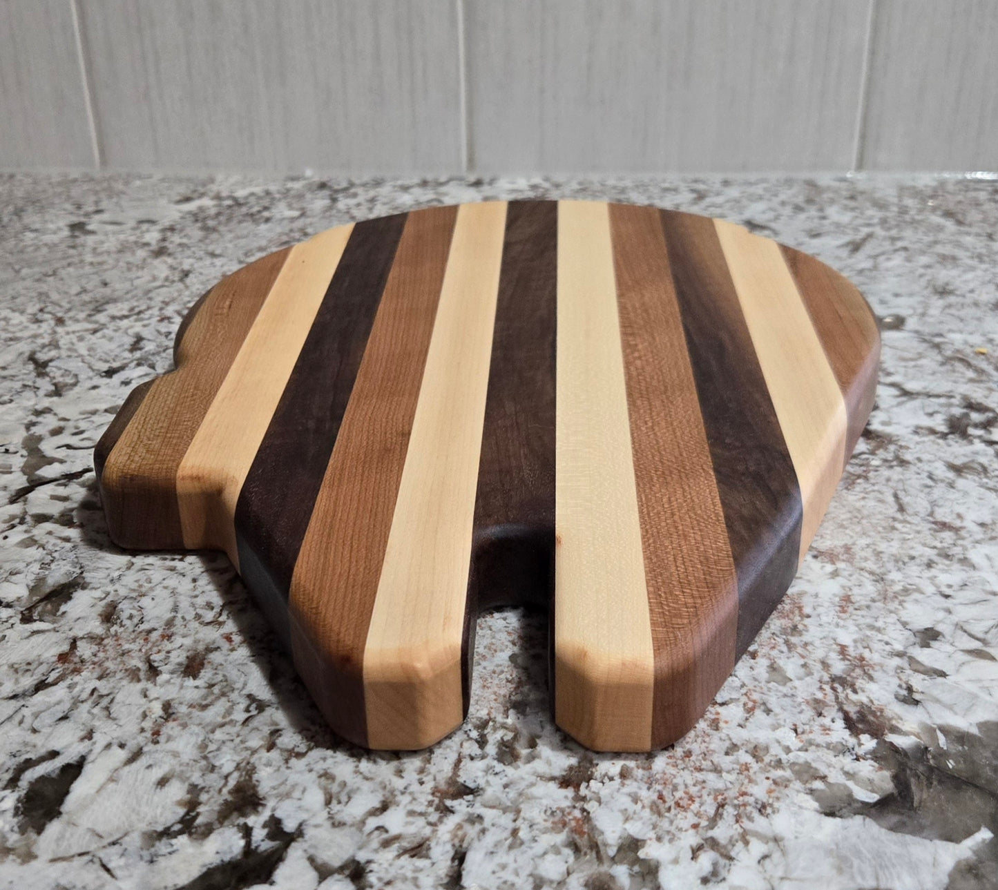Walnut, Maple and Cherry Millennium Falcon Edge Grain Cutting Board.