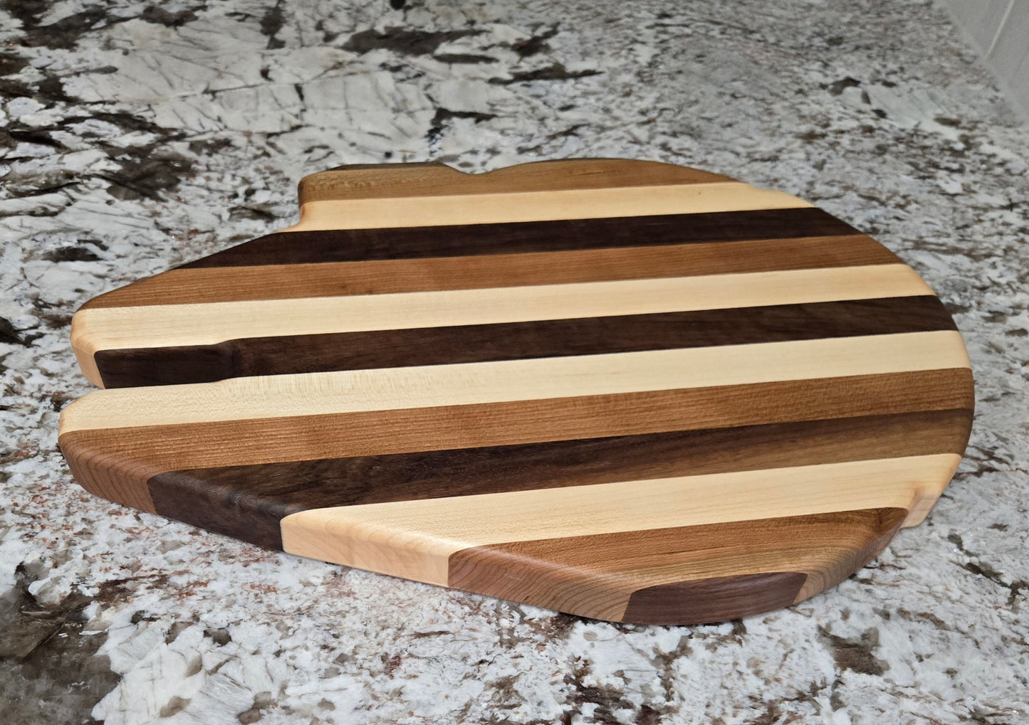 Walnut, Maple and Cherry Millennium Falcon Edge Grain Cutting Board.